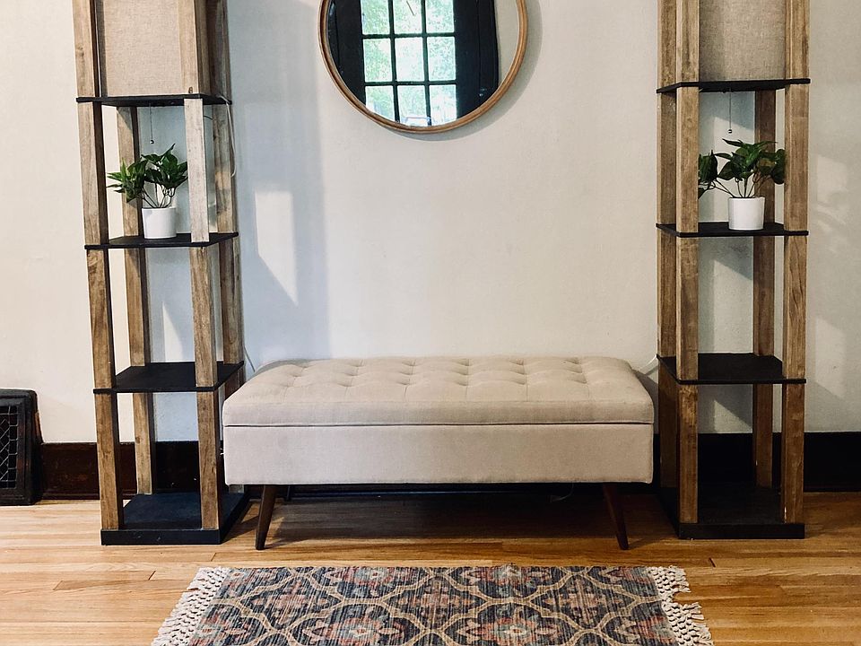 View of the front door and sitting area for preparation for leaving the house.