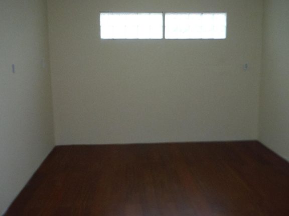 Newly added bedroom Brazilian cherry flooring , access to back yard, two large closet armoires being installed for plenty of closet space. 11 foot wide by 25 foot long.