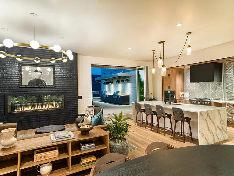 Host with ease in Modera Shoreline's entertainment kitchen, where elegant finishes and seamless indoor-outdoor flow set the stage for memorable evenings.