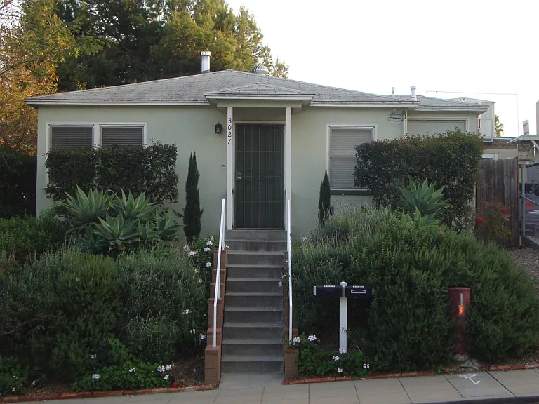 Front of duplex. Corner of Elm and Fern