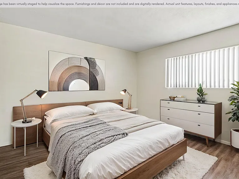 Spacious bedroom with large window.