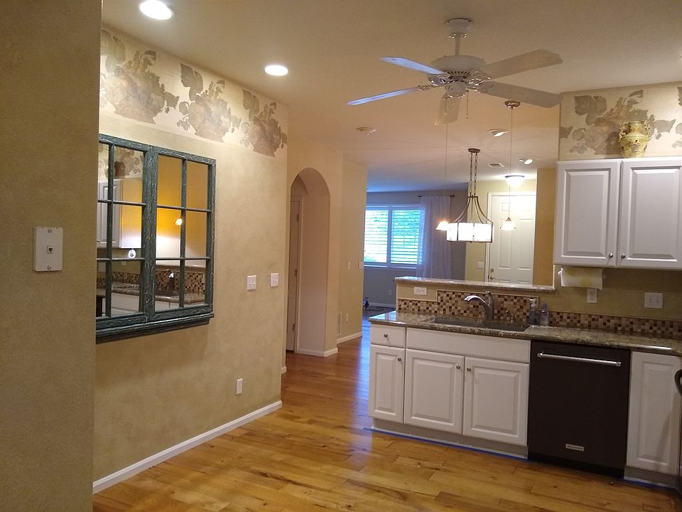 Area to put a small table and chairs for in kitchen eating. View into Dining Room and Living Room from the Kitchen