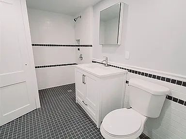 downstairs bathroom with walk in shower