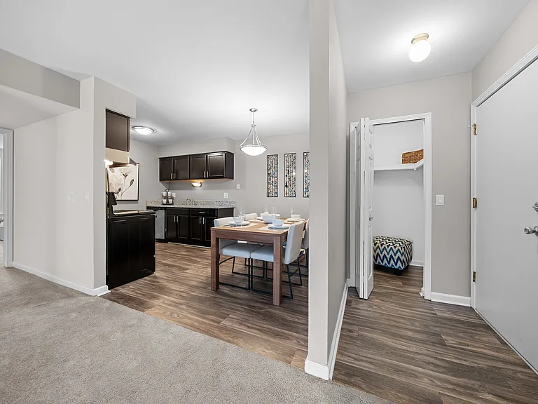 Open concept Living-Dining Area with natural lighting at Lakeside Village Apartments Clinton Township, MI