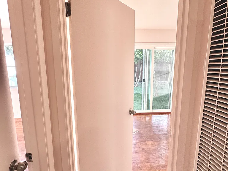 Hallway (Master Bedroom to the left, Bedroom with Sliding Patio Door straight ahead, 3rd bedroom on the right)