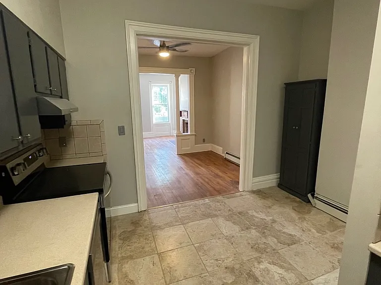 View of Kitchen, Dining, Room, Living Room from Barn Door to Bedroom / Washer & Dryer Location