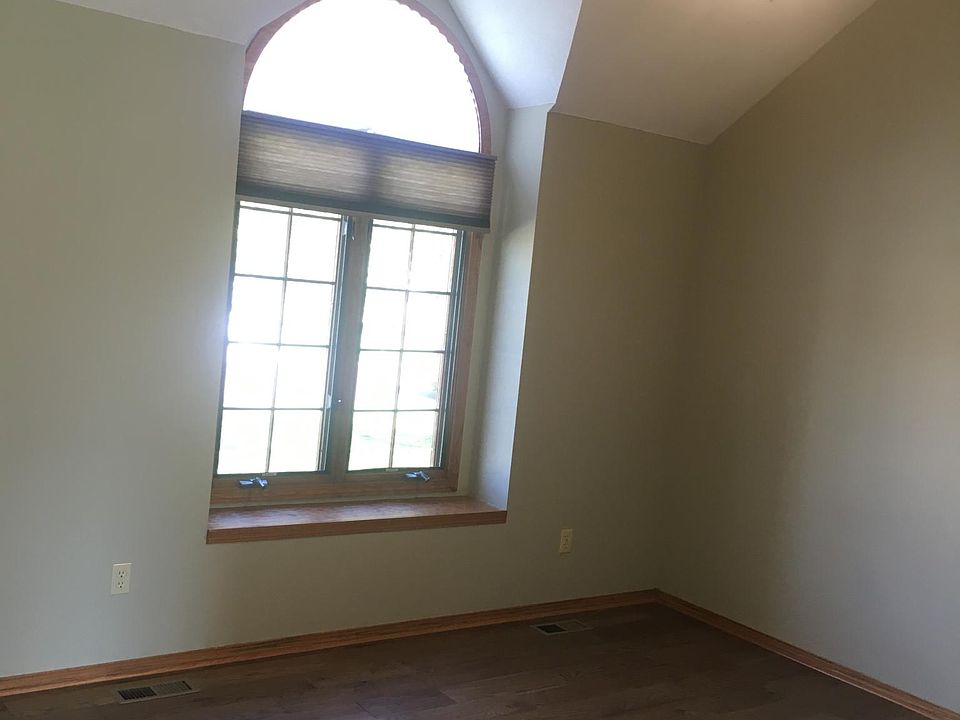 Vaulted ceiling with new ceiling fan.