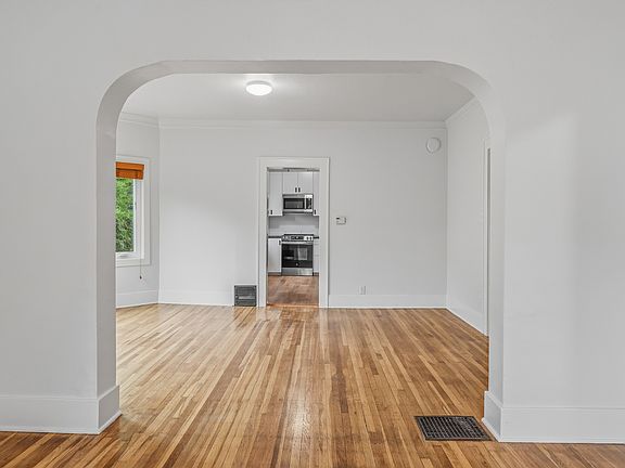 looking from living room into dining and kitchen area