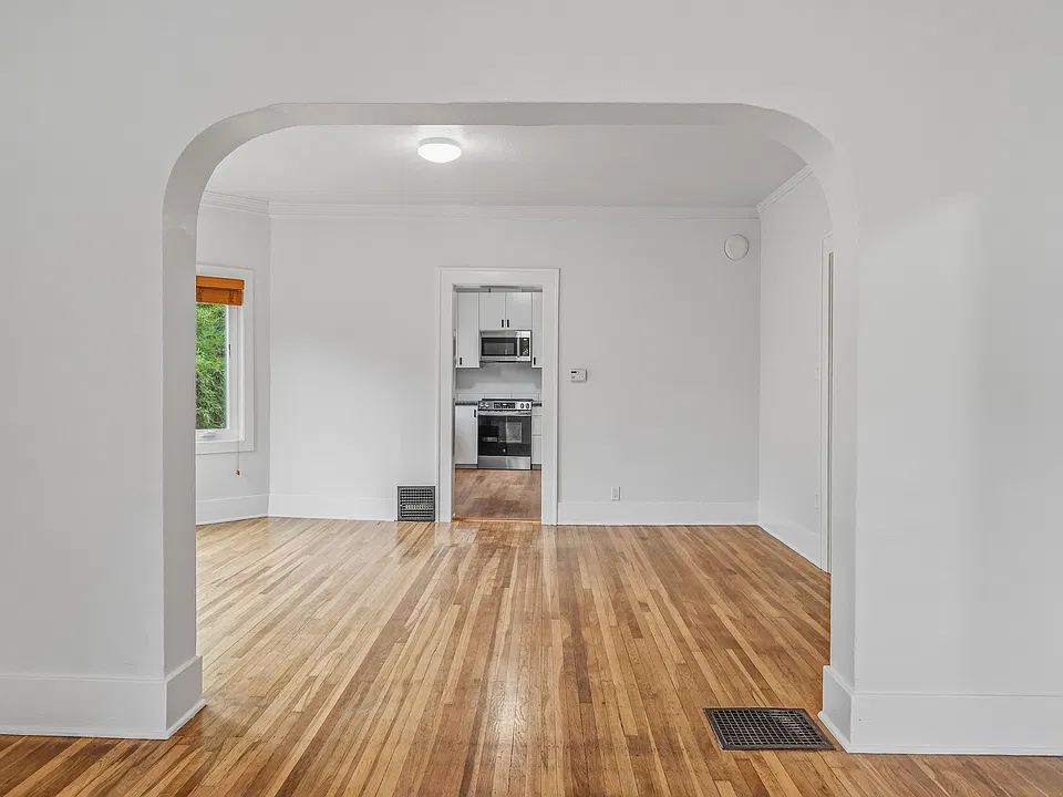 looking from living room into dining and kitchen area