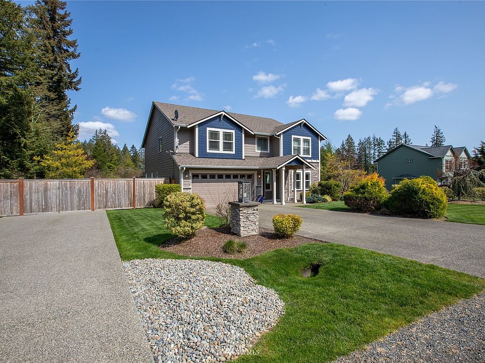 Home sits on 1/2 acre lot with 2 driveways