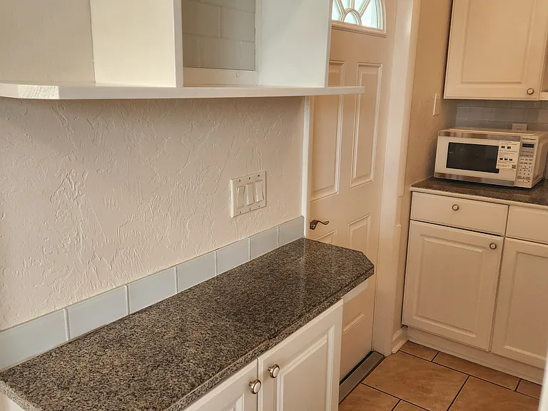 Kitchen includes Refrigerator, Stove, Microwave