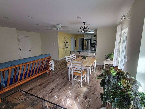 View into the Living/Dining Room when entering through main door. The door to the left leads to main house and will be locked/blocked. Which makes this space suitable for a workdesk?