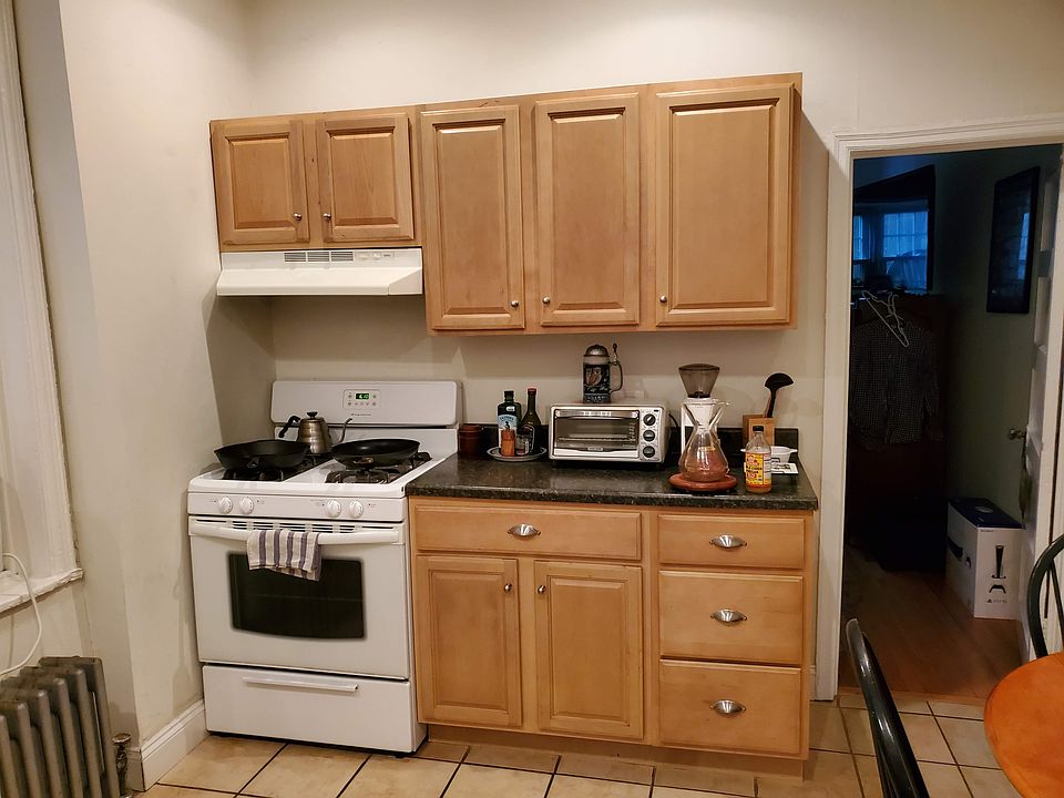 Kitchen with door to bedroom.