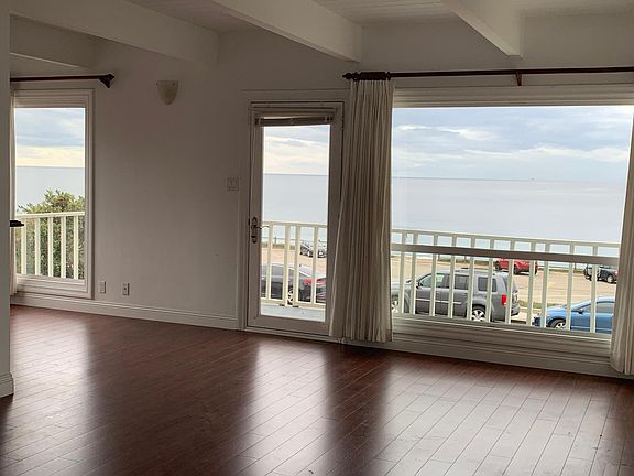 Huge open concept living room and dining room combination that has the stunning ocean views that will mesmerize you