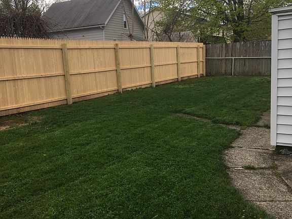 Private, mostly fenced-in backyard with small, locked shed