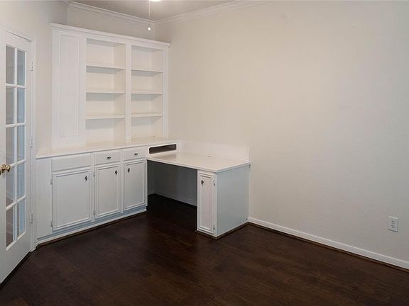 The private study with French doors and built in desk is to the right of the front entrance.