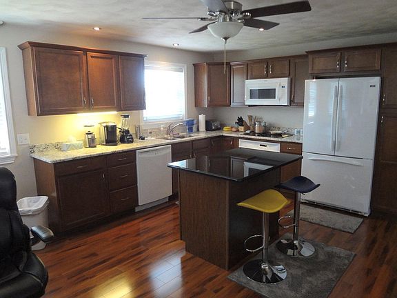 Kitchen has granite counter tops and comes with all amenities.