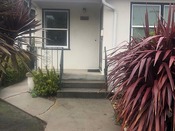 Left side of duplex, entry facing Alhambra Avenue