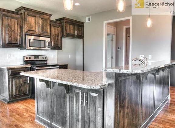 Stainless steel appliances and granite counters