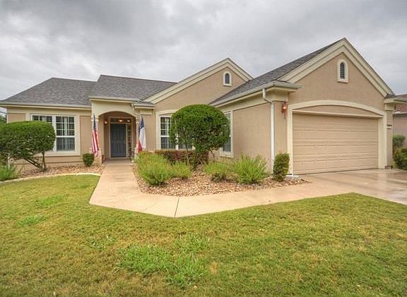 Nestled against the woodsy banks of Berry Creek, this Sun City Texas Cortez Estate Home offers a flexible floor plan ready for your own impressions.