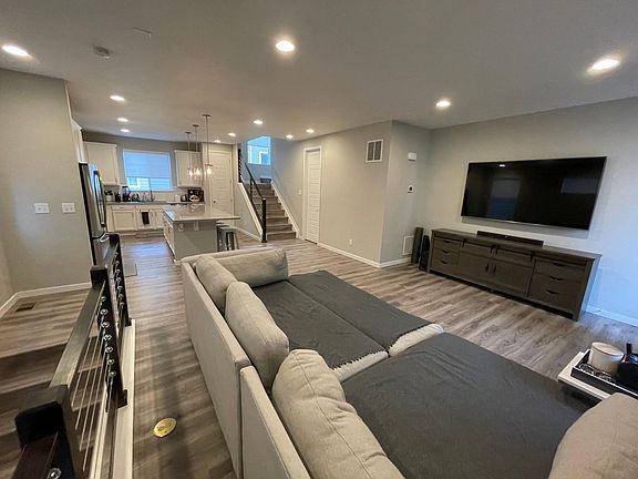 Middle Level- living room and kitchen with a patio off of the living room