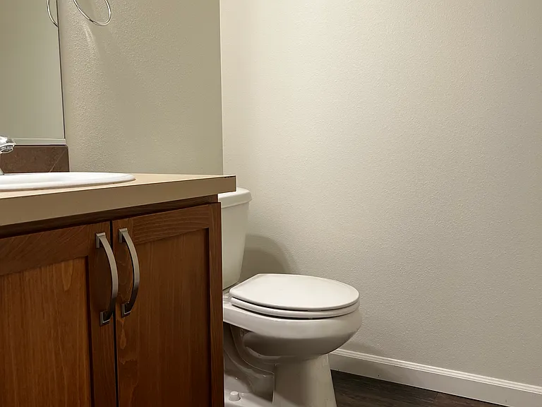 Main floor powder room with freshly painted walls and ceiling