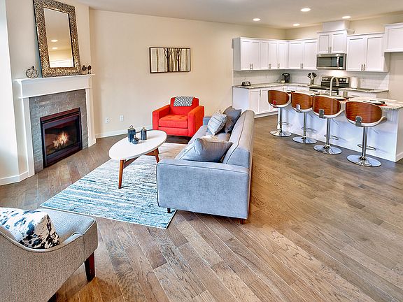 Open Main Floor Layout Featuring Extensive Hardwood Flooring