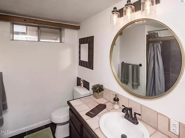Full bath with shower on main floor.