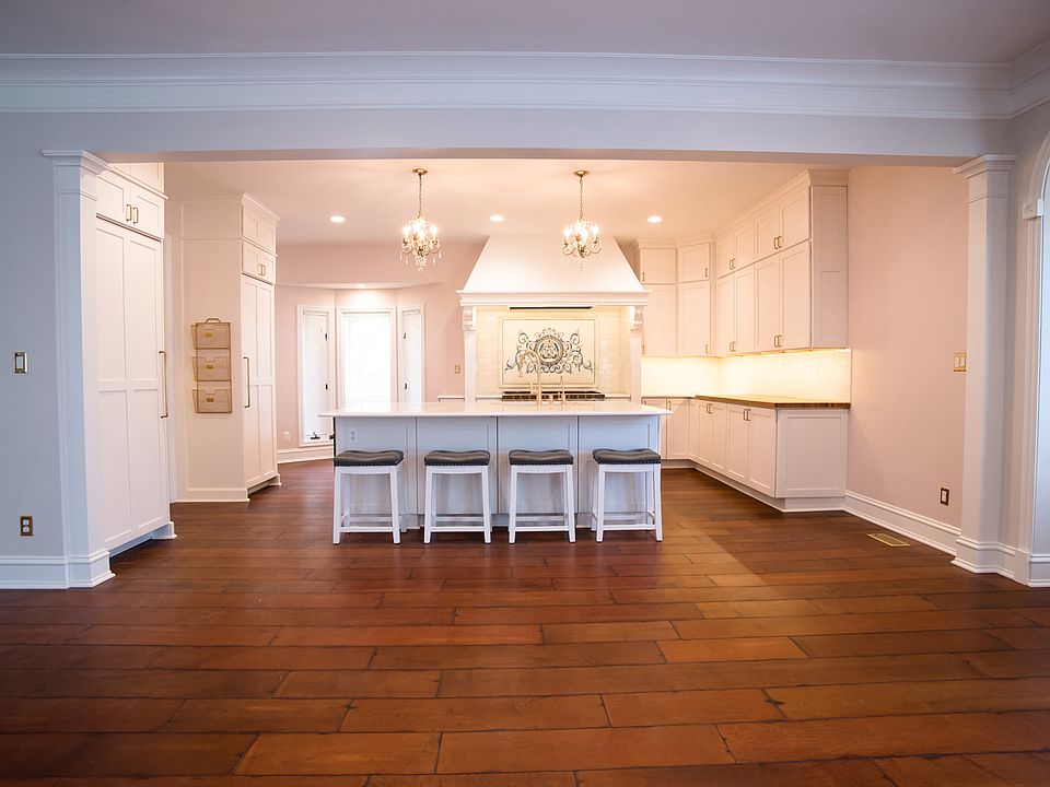 A show-stopping gourmet kitchen to create with, complete with wide passageways for multiple cooks, custom wood cutting board countertop, a pair of separate 30" freezer and fridge (both built-in's) and numerous other well thought out details.