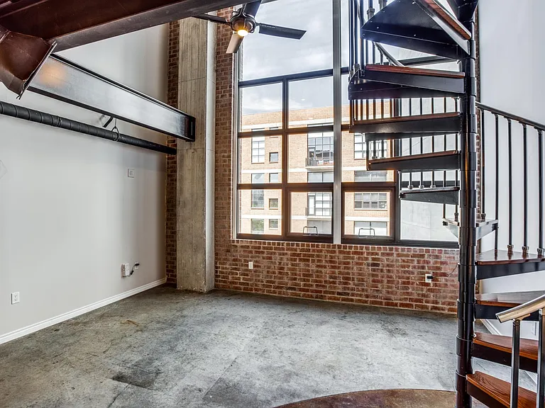Ascend in style with a stunning spiral staircase that adds an architectural flair and a touch of sophistication to your living space.