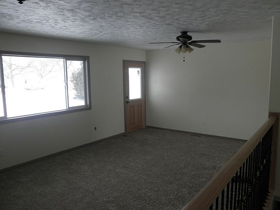 Living room-rustic alder door.