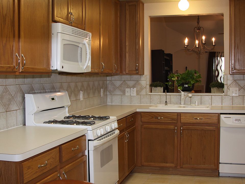 Kitchen with gas stove top opens to dining / family room