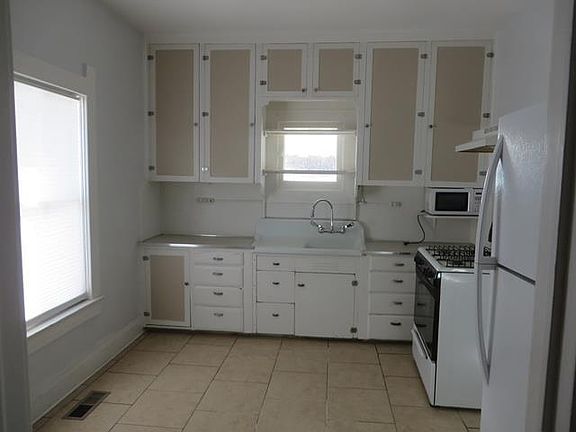 Bright kitchen with lots of cabinet space.