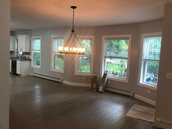 open kitchen dining room with beautiful widows and lighting