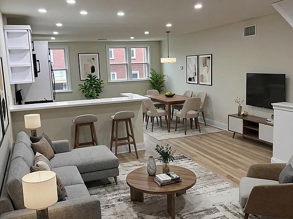 Open layout - living room, chef's kitchen, & dining room