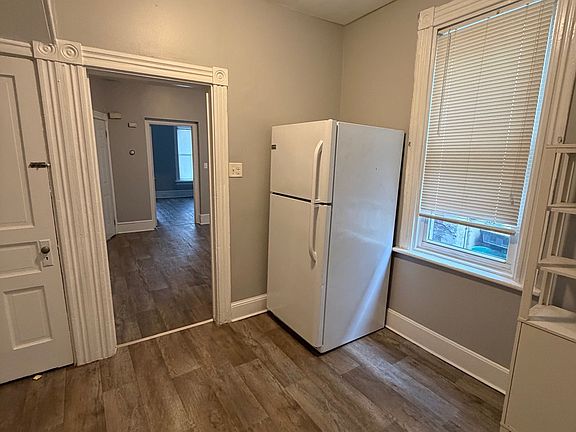 Basement door on left and right door leading to living room.