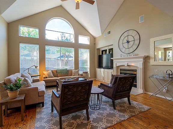 SOARING CEILINGS IN AN AWESOME FAMILY ROOM WITH LOTS OF NATURAL LIGHT