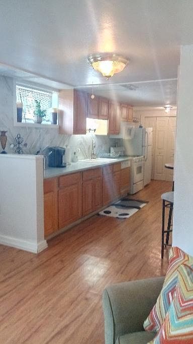 Spacious kitchen with quartz and marble.