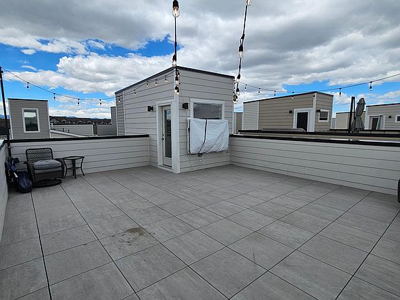 Huge 26' x 21' rooftop deck with included TV begging to entertain family and friends