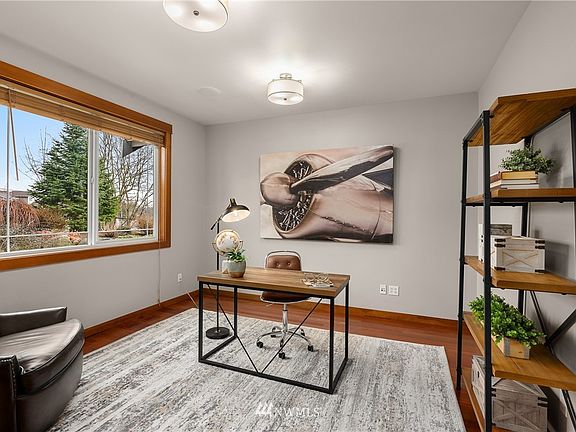 Double doors to main level office with high ceiling & front yard views.