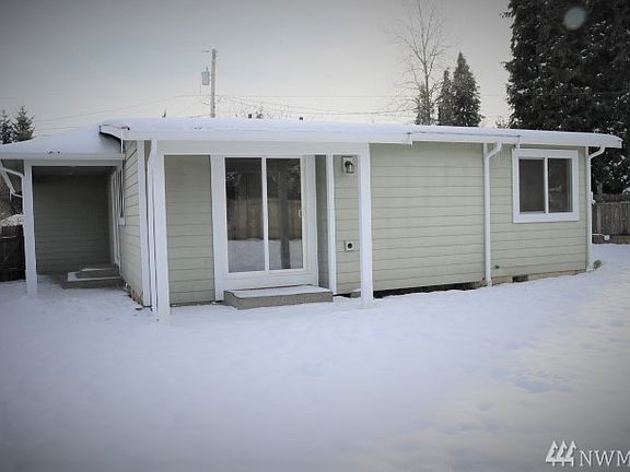 Covered back patio with room for your BBQ.