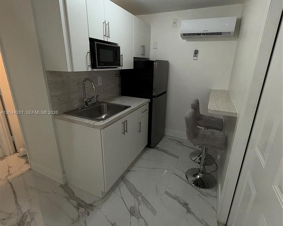 1st image of 6497 W 8th Ln #6497