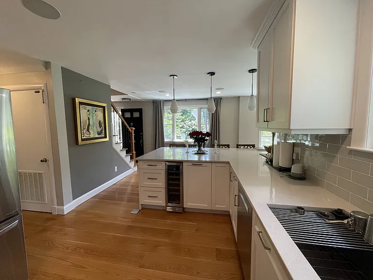 Kitchen. Notice the ceiling speakers, wine fridge, Bosch dishwasher, and 36" sink.