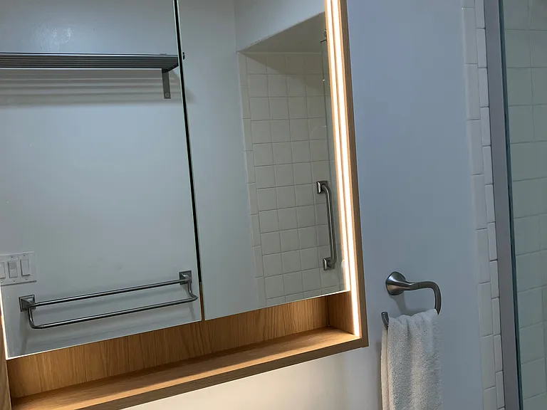 Bathroom- with illuminated, mirrored 'medicine cabinet'