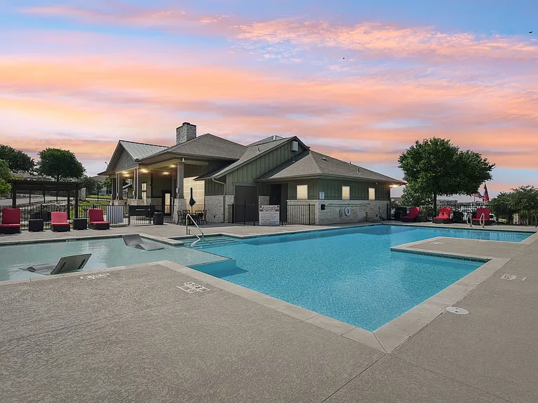 Evening View of Pool Clubhouse Fireplace Lounge Outside at Overlook at Stone Oak Park Apartments, San Antonio, 78258