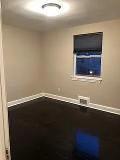 Master Bedroom with gleaming hardwoods