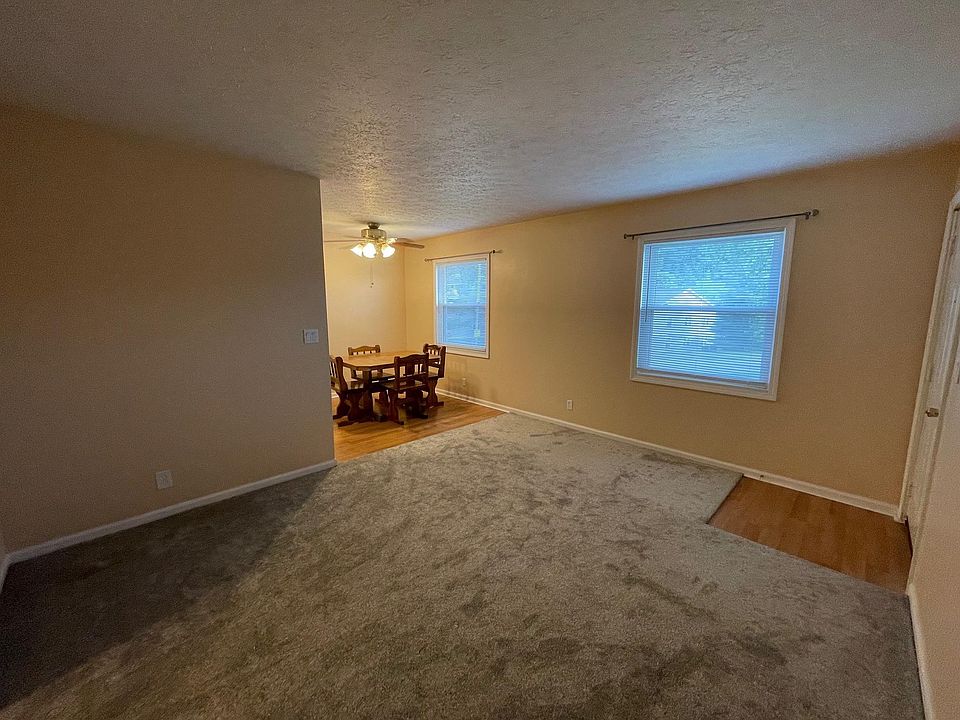 Living room (dining set not included).