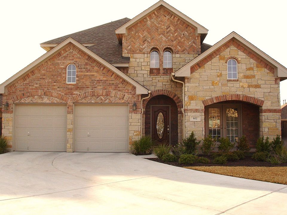  Stone & brick front with extra wide and long driveway for ample parking