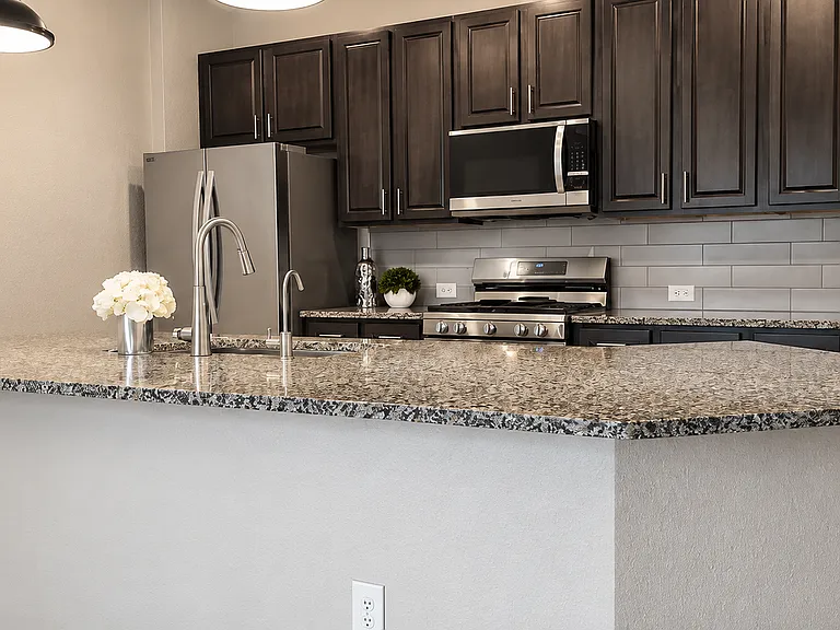 Family-sized kitchen featuring a large centerpiece island, perfect for breakfast, homework, meal prep, and gatherings