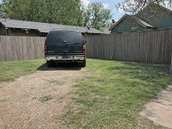 Extra spacious off street parking area with plenty of room for 2 cars
